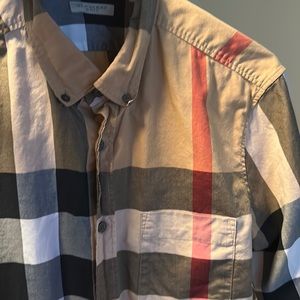 Burberry shirt used once awesome condition great shirt
Fits like a small